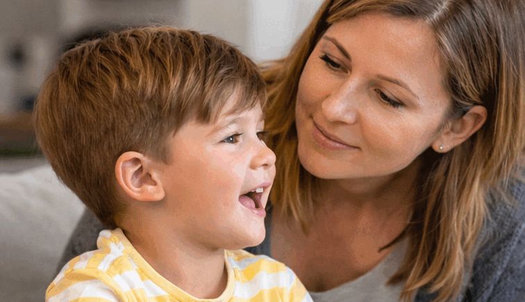 A mother trying to understand what her young son is saying