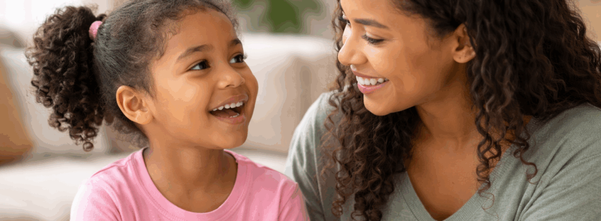 A mother helping her young daughter with speech therapy