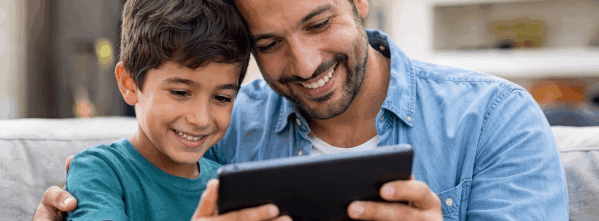 A son and father engaging in online therapy on their ipad.