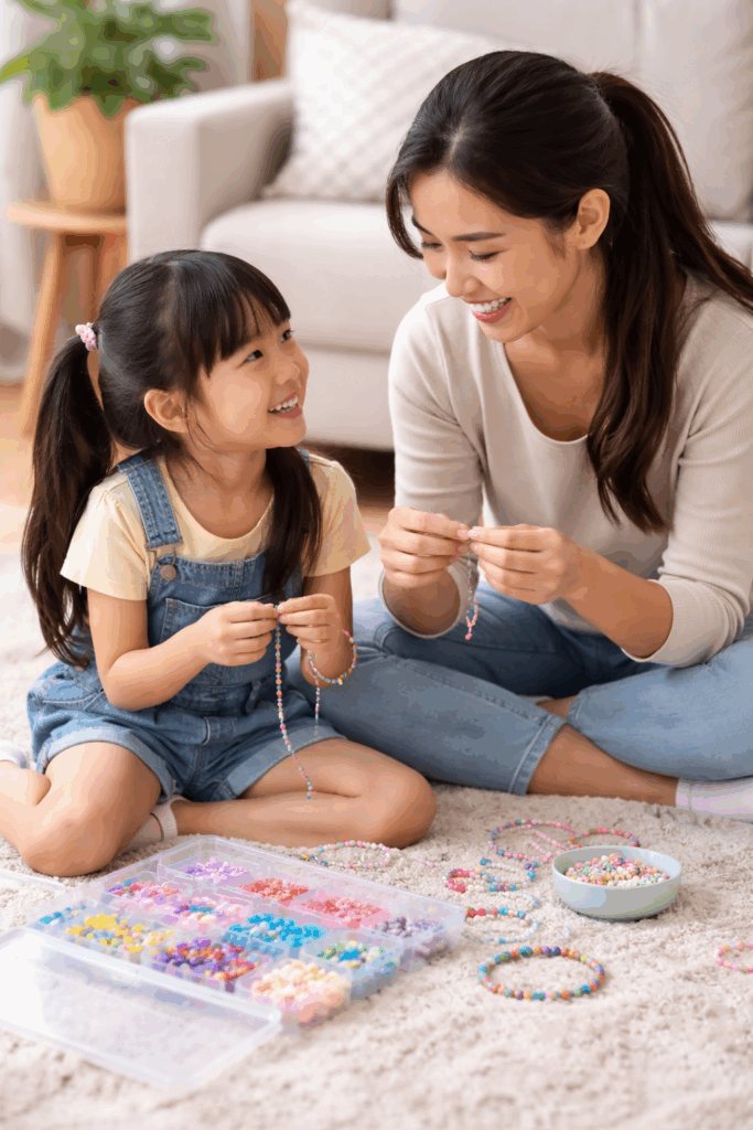 A little girl has fun making bracelets with her mother while they work on her speech sounds